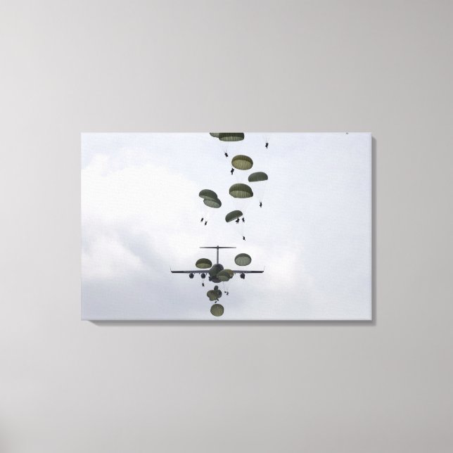 Army Soldiers jump out of a C-17 Globemaster II Canvas Print (Front)