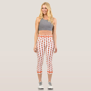 Art deco element in orange capri leggings