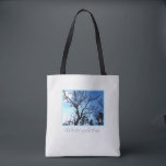 As the tree spirit sleeps tote bag<br><div class="desc">This As the tree spirit sleeps Tote Bag features the branches of a twisted old tree silhouetted against a chilly blue sky, and says "As the tree spirit sleeps... " The light textured background adds to the seasonal mood. Offered in Medium (shown) and Large, the bag is perfect for your...</div>