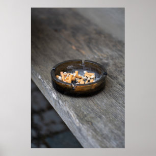 Ashtray filled with cigarette butts and ashes poster