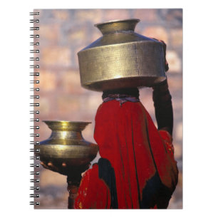 Asia, India, Rajasthan. A local woman in a red Spiral Notebook