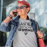 Ask Me About My New Grandchild Black Text T-Shirt<br><div class="desc">Ask Me About My New Grandchild Black Text. Humour for the new grandmother to wear,  an artsy typographical design with fun quote,  in black typography with heart motifs,  which can be changed to another colour if you wish via customise further.</div>