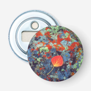 Aspen leaf on a lichen covered rock bottle opener