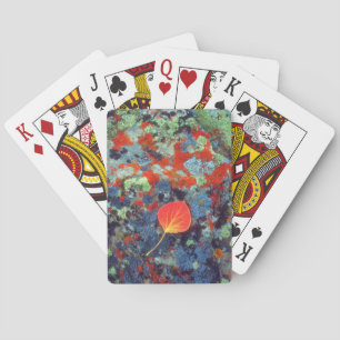 Aspen leaf on a lichen covered rock playing cards