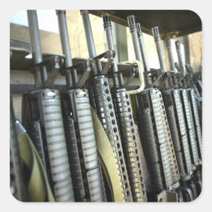 Assault rifles stand ready on the weapons rack square sticker