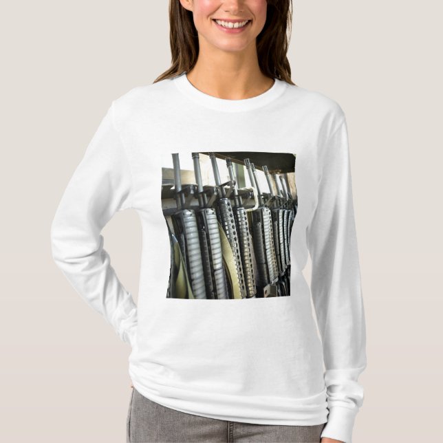 Assault rifles stand ready on the weapons rack T-Shirt (Front)