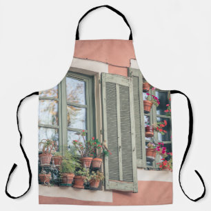 ASSORTED-COLOR FLOWERS IN VASE NEAR WINDOW APRON