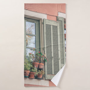 ASSORTED-COLOR FLOWERS IN VASE NEAR WINDOW BATH TOWEL