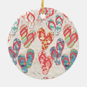 Assorted flip flops on sand, unique ceramic tree decoration