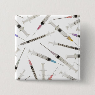 Assortment of syringes in various sizes and 15 cm square badge