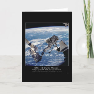 Astronaut David A. Wolf transfers the Starboard Card