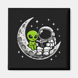 Astronaut reading book alien moon space  magnet