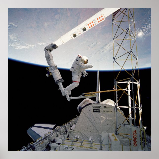 Astronaut working aboard Space Shuttle Atlantis Poster (Front)