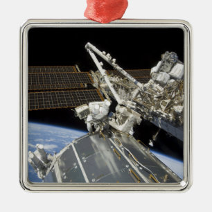 Astronauts perform a series of tasks metal tree decoration