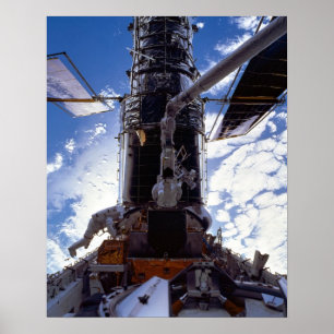 Astronauts work on the Hubble Space Telescope Poster