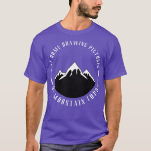 At home drawing pictures of mountain tops