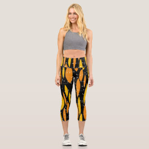 Atomic style, black orange geometric pattern. capri leggings