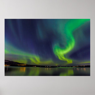 Aurora borealis over a lake poster