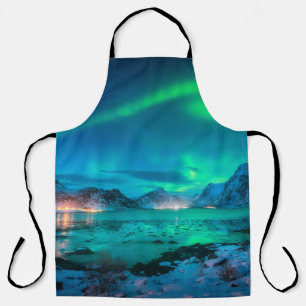 Aurora borealis over the sea coast, snowy mountain apron