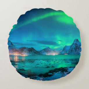 Aurora borealis over the sea coast, snowy mountain round cushion