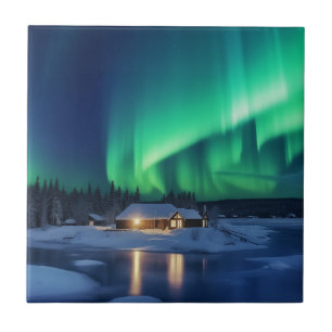 Aurora borealis over winter cabin tile
