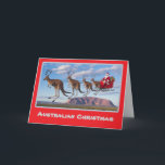 Australian Christmas Card<br><div class="desc">A team of kangaroos with antlers are pulling Santa in his sleigh with Ayer's Rock in the background.</div>