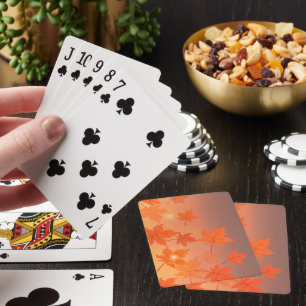 Autumn design with maple leaves and bokeh effect playing cards