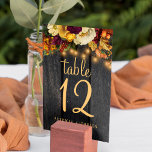 Autumn fall rustic wood wedding table number<br><div class="desc">Rustic country elegant wedding table number with editable text featuring fall botanicals and a chic script on a dark brown barn wood background with string lights. Ideal for your summer or autumn fall garden backyard outdoor or farmhouse wedding.</div>