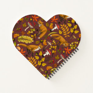 Autumn foxes on black notebook