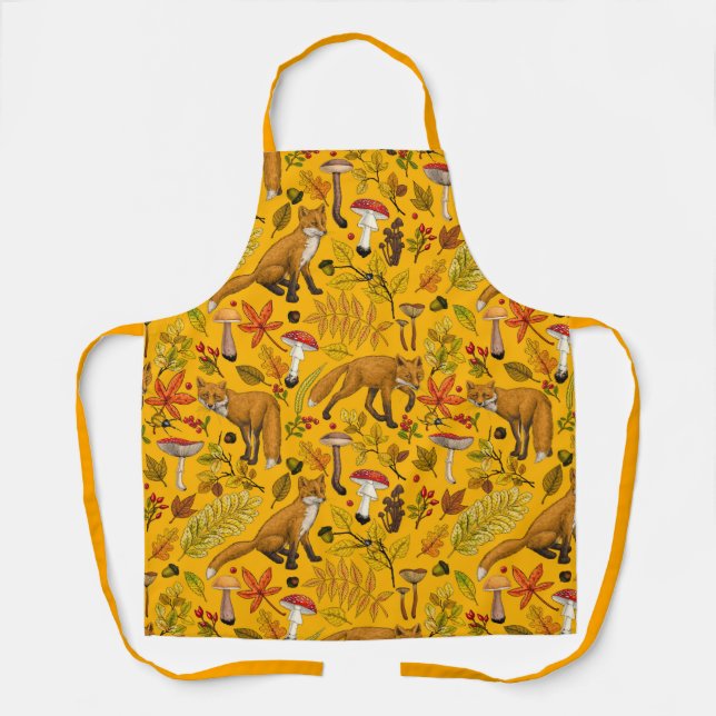 Autumn foxes on orange apron (Front)