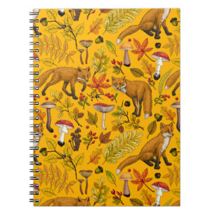 Autumn foxes on orange notebook