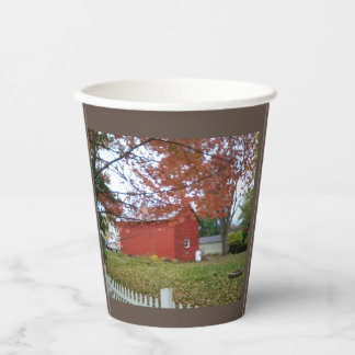 Autumn leaves and a sweet red barn on a mug. coffe paper cups