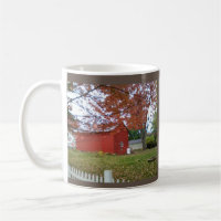 Autumn leaves and a sweet red barn on a mug.