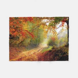 Autumn Leaves and Trees Covering Dirt Road Fleece Blanket