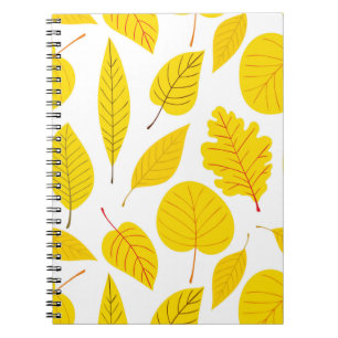 Autumn leaves in yellow notebook