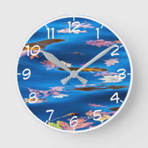 Autumn Leaves on Blue Water Round Clock