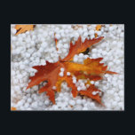 Autumn Maple Leaf in Real Hail - Dramatic Weather  Postcard<br><div class="desc">A unique macro shot of a bright orange maple leaf lying on a thick layer of fresh hail stones. This rare weather event captures the raw beauty of a sudden hailstorm during the autumn season. The contrast between the warm leaf and the icy white hail creates a stunning visual.</div>