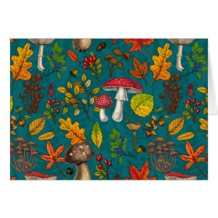 Autumn mushrooms, leaves, nuts and berries on blue