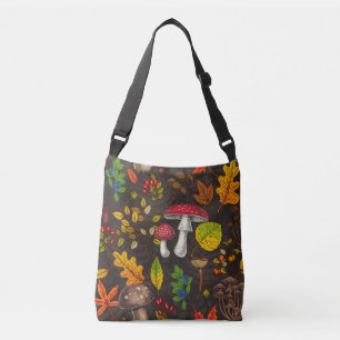 Autumn mushrooms, leaves, nuts and berries on blue crossbody bag