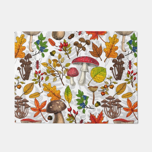 Autumn mushrooms, leaves, nuts and berries on blue doormat (Front)