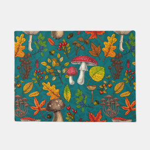 Autumn mushrooms, leaves, nuts and berries on blue doormat