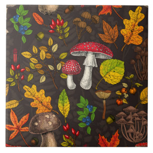 Autumn mushrooms, leaves, nuts and berries on blue tile