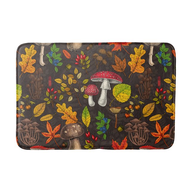 Autumn mushrooms, leaves, nuts and berries on dark bath mat (Front)