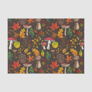 Autumn mushrooms, leaves, nuts and berries on dark tissue paper