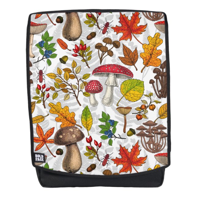 Autumn mushrooms, leaves, nuts and berries on whit backpack (Front)