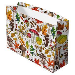 Autumn mushrooms, leaves, nuts and berries on whit large gift bag
