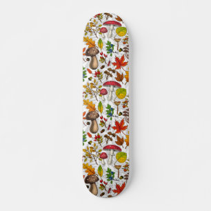Autumn mushrooms, leaves, nuts and berries on whit skateboard