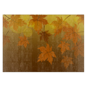 Autumn pattern with falling maple leaves and bokeh cutting board