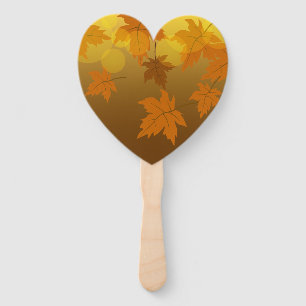 Autumn pattern with falling maple leaves and bokeh hand fan