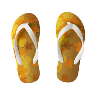Autumn pattern with falling maple leaves and bokeh kid's jandals